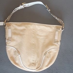 Beige/cream colored coach purse